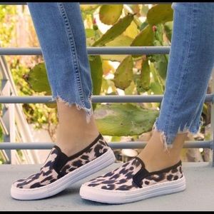 Brand new, never worn cheetah pattern sneakers.